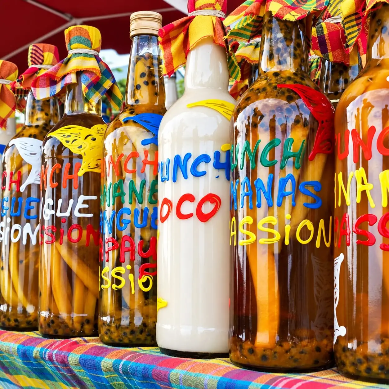 Bottles of homemade rum punch at the Pointe-à-Pitre market